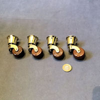 Set of 4 Brass and Ceramic Castors C51