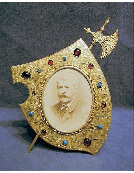 Battle Axe and Shield Brass Photograph Frame — Brass, late 19th century