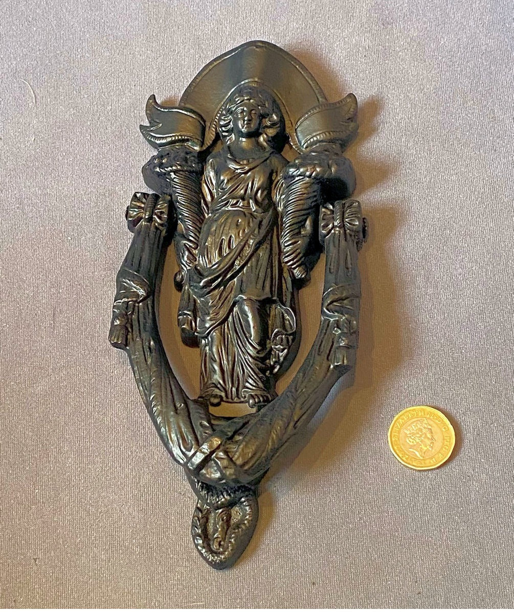 Cast Iron Door Knocker — Cast iron, late 19th century