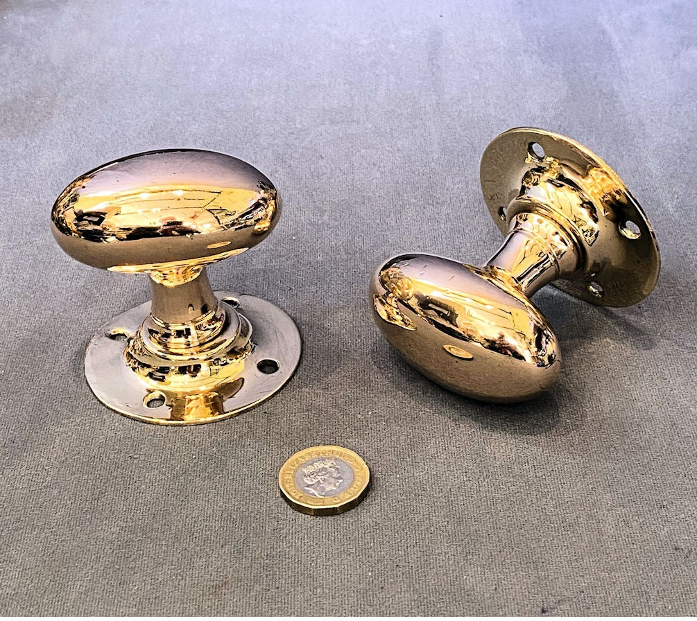 g Pair of Oval Brass Door Handles — Brass, 1920's