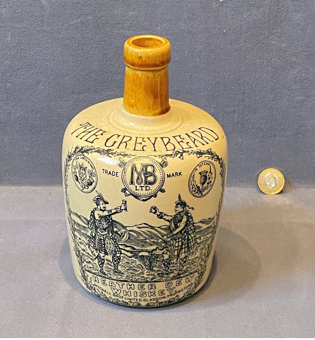 Greybeard Stoneware Whiskey Jug — Stoneware, late 19th century
