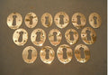Many Similar Pressed Brass Keyhole Surrounds — Brass, circa 1900