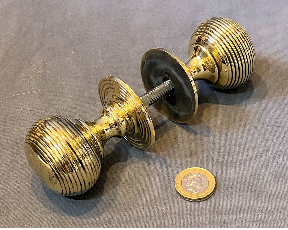 Near Pair of Ribbed Brass Door Handles — Brass, late 19th century