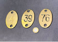 Numbered Brass Discs, 4 available — Brass, late 19th century
