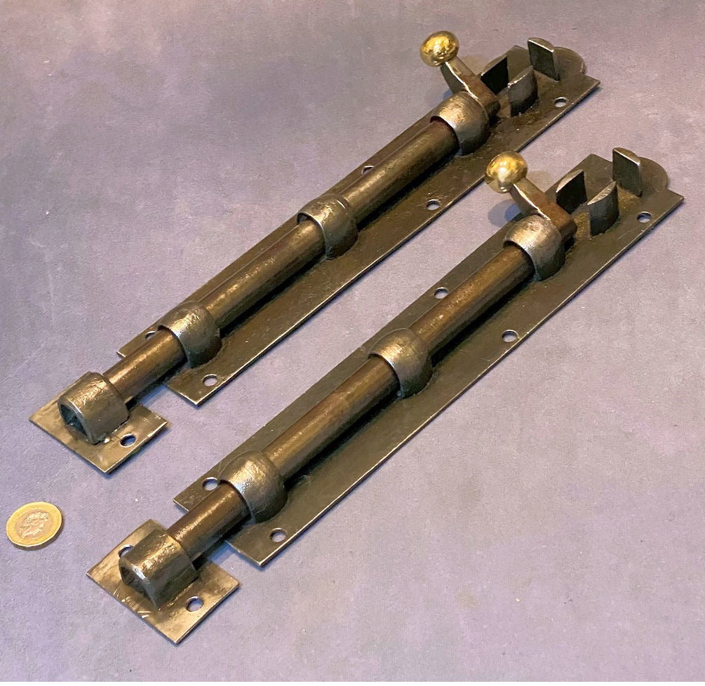 Pair of 11" Wrought Iron Door Bolts — Wrought iron, late 19th century
