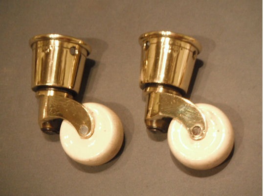 Pair of Brass and Ceramic Castors — Brass, late 19th century