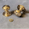 Pair of Brass Door Handles — Brass, late 19th century