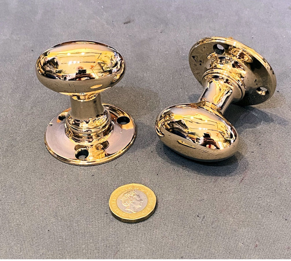 Pair of Oval Brass Door Handles — Brass, late 19th century