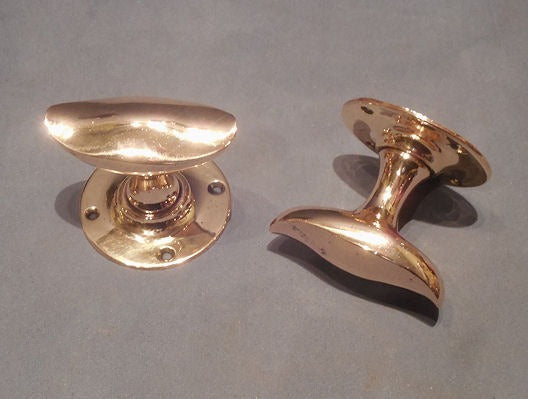 Pair of Oval Brass Door Handles — Brass, late 19th century