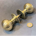 Pair of Ribbed Brass Door Knobs — Brass, late 19th century