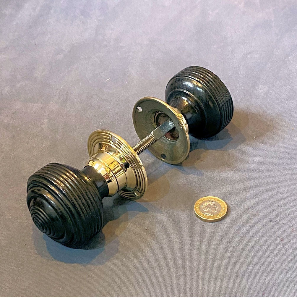 Pair of Ribbed Ebony Door Handles — Brass, late 19th century