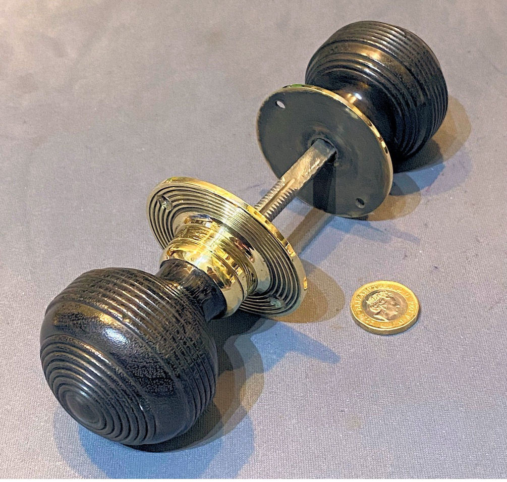 Pair of Ribbed Ebony Door Handles — Brass, late 19th century