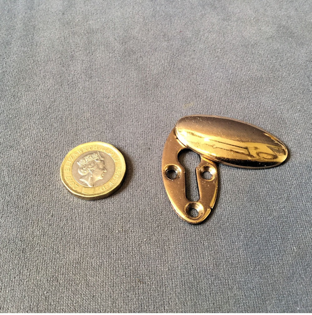 Pink Brass Keyhole Cover — Brass, circa 1900