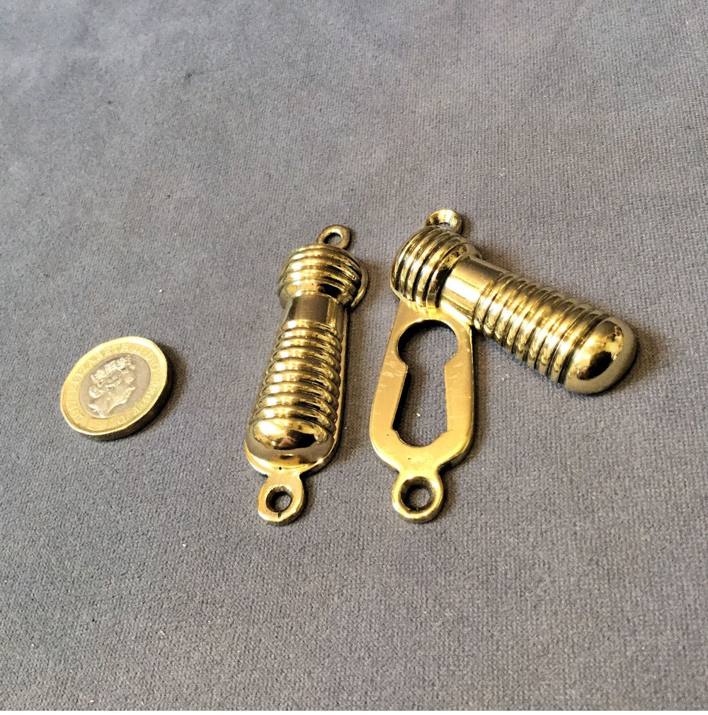 Run of Ribbed Brass Keyhole Covers, 2 available — Brass, late 19th century