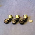 Set of 3 Brass and Ceramic Furniture Castors — Brass, late 19th century
