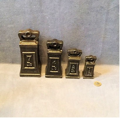 Set of 4 Cast Iron Weights — Cast iron, circa 1900
