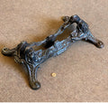 Sirens Cast Iron Bicycle Stand — Cast iron, late 19th century