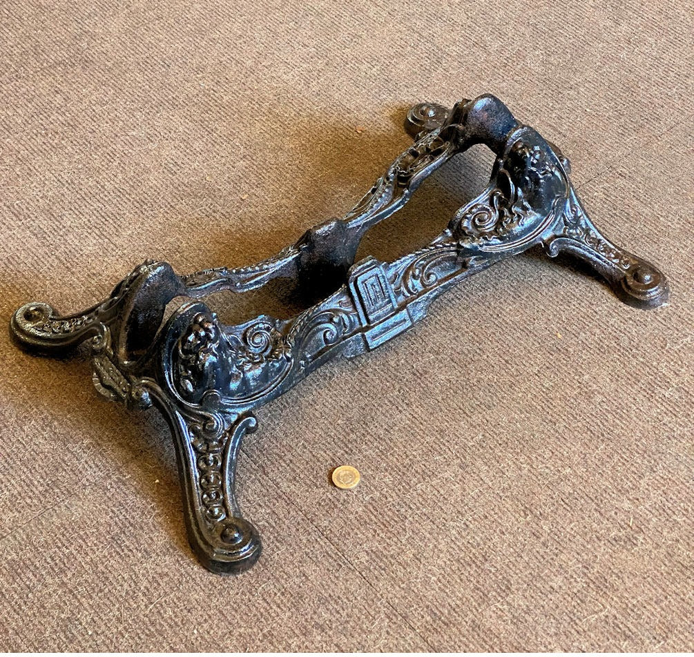 Sirens Cast Iron Bicycle Stand — Cast iron, late 19th century